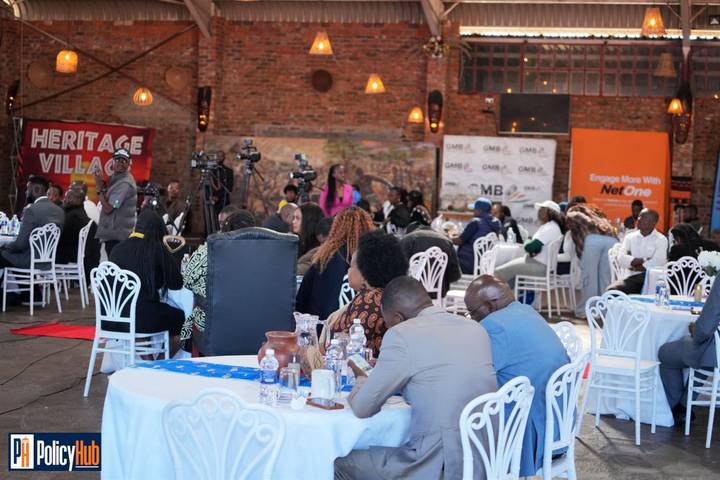 Delegates seated at round tables during the National Policy Expo