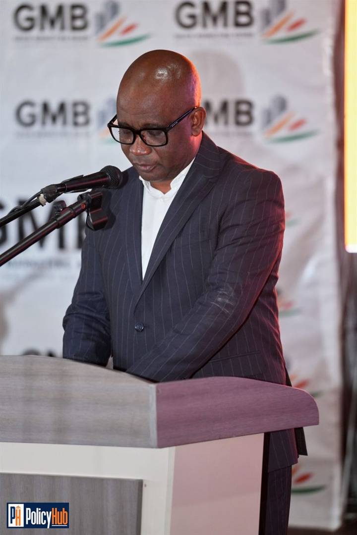 Speaker reading remarks from a podium